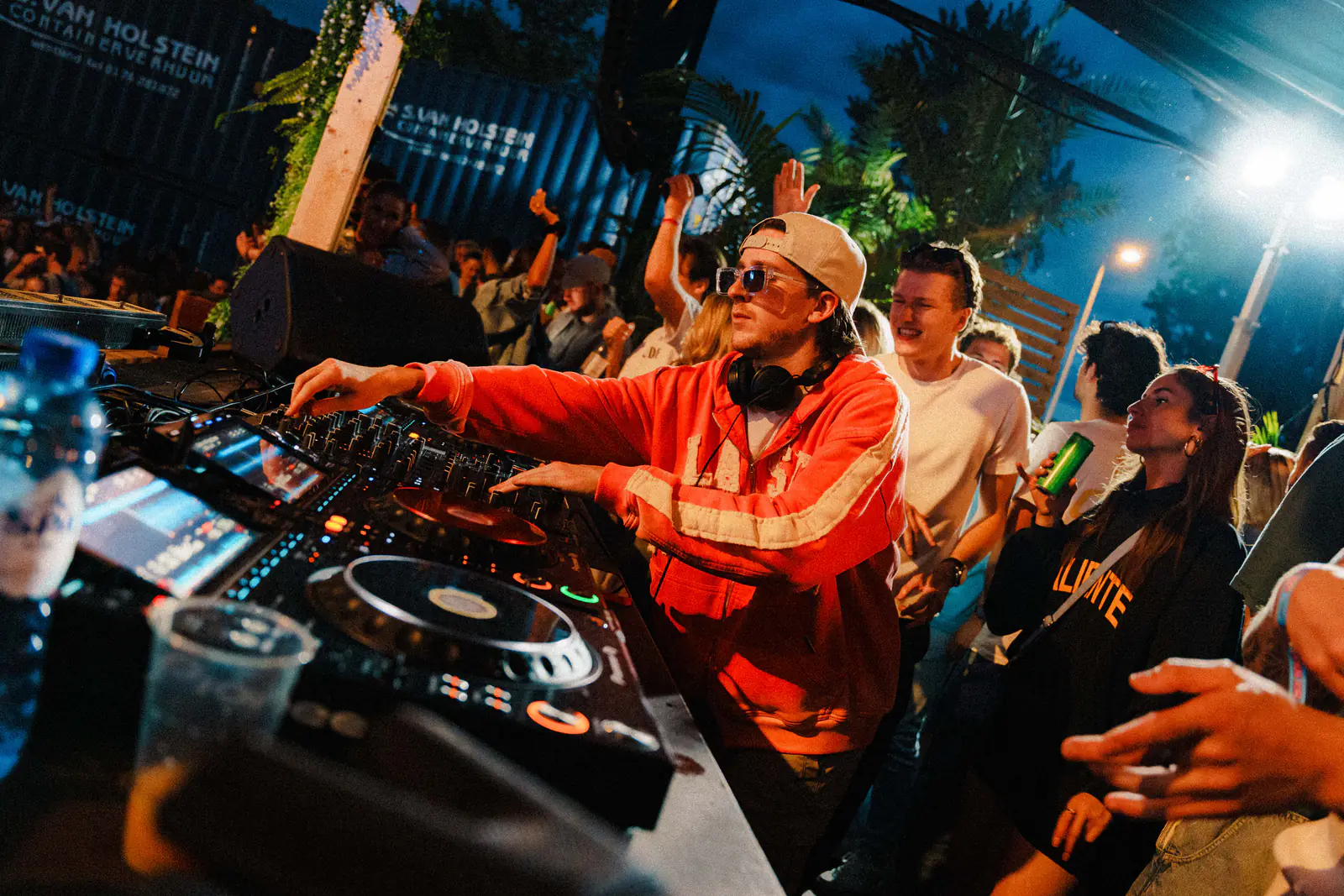 DJ booth with crowd and blue stage light