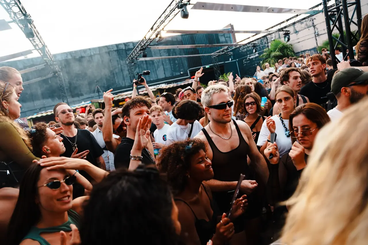 Outdoor crowd at a daytime music event