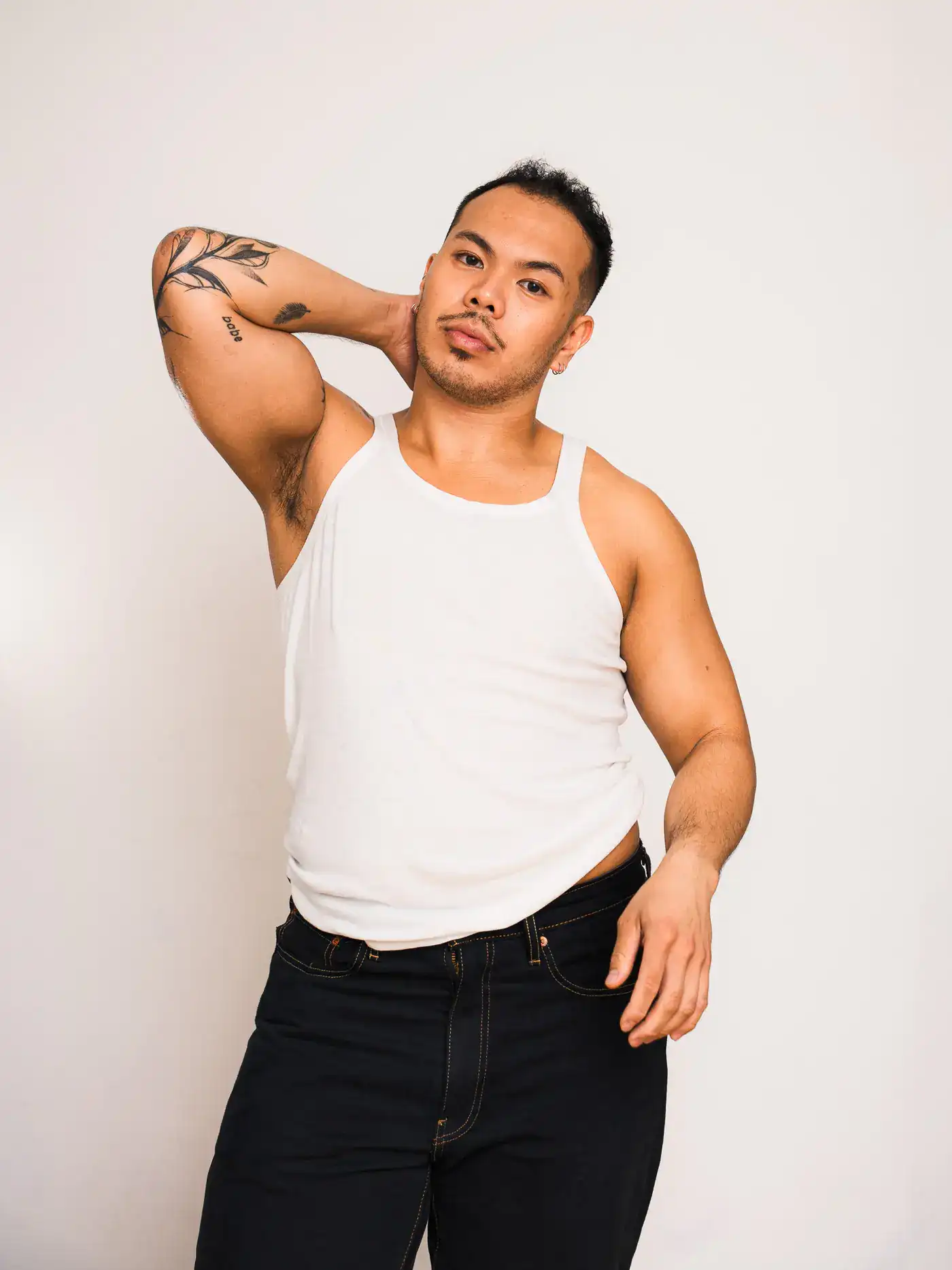 Studio portrait against a plain backdrop
